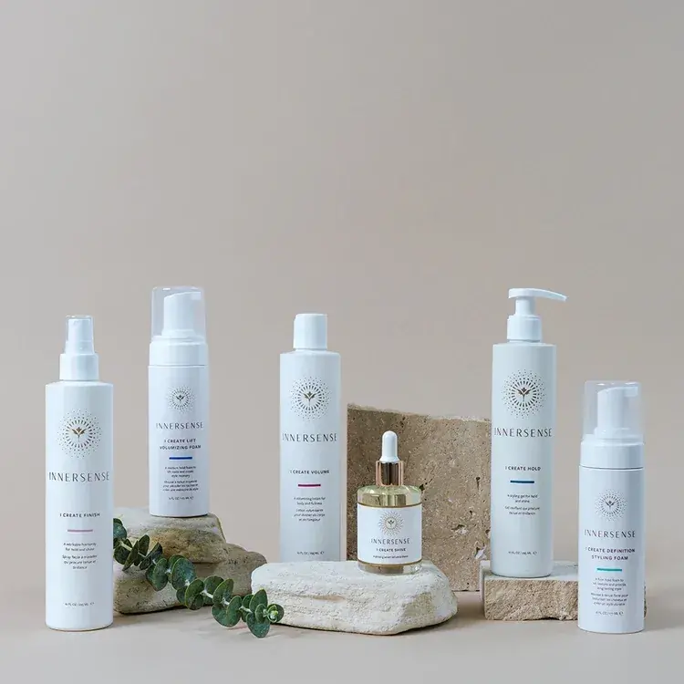 Innersense hair care products arranged on stone blocks